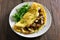 Omelet with mushrooms, chicken meat, greens