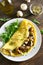 Omelet with mushrooms, chicken meat, greens