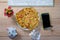 Omelet with onion leaves and tomato on desk