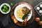 Omelet. Spinach oyster mushroom and cheese omelet or frittata on dark old wooden background. Breakfast idea. Top view with copy