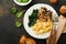 Omelet. Spinach oyster mushroom and cheese omelet or frittata on dark old wooden background. Breakfast idea. Top view with copy