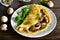 Omelette with mushrooms, chicken meat, greens