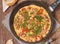 Omelette with sausage, onion, herbs and tomatoes