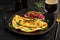 Omelette with sausage, sweet peppers and sandwich with marinated red onions. Frittata - italian omelet