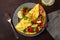 Omelette with tomato, avocado onion chili and sweet corn. healthy keto diet low carb breakfast