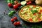 Omelette with tomatoes zucchini and potatoes on dark background healthy diet food for breakfast tasty morning food