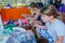 Omer, Negev, Israel - August15, Children paint colors t-shirts on a table, 2015