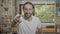 Omg reaction of a excited amazed young man pointing index finger at something surprising at home -