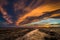 An ominous cloud formation is illuminated during golden hour out in the countryside of midwest america