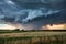Ominous storm brews over rural farm in dramatic sky
