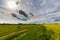 Ominous storm clouds and canola fields