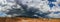 Ominous Stormy Sky and Cumulus Clouds with Rain Pano in the Desert