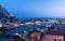 Omis Landscape at sunset with the moon. The city is lit by electricity