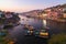 Omkareshwar cityscape at dusk, India, sacred hindu temple. Holy Narmada River, boats floating. Travel destination for tourists and