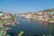 Omkareshwar cityscape, India, sacred hindu temple. Holy Narmada River, boats floating. Travel destination for tourists and pilgrim