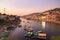 Omkareshwar cityscape, India, sacred hindu temple. Holy Narmada River, boats floating. Travel destination for tourists and pilgrim