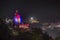 Omkareshwar cityscape by night, India, sacred hindu temple illuminated. Travel destination for tourists and pilgrims