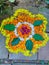 Onam festival flower mat made using flowers and leaves.