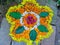 Onam festival flower mat made using flowers and leaves.