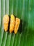 Onam special jaggery coated banana chips on a banana leaf.