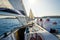 Onboard view of racing sailing yacht with a crew sitting on the starboard side