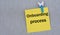 ONBOARDING PROCESS - words on yellow paper with clothespin on gray background