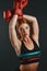 Once you become fearless, life becomes limitless. Studio portrait of a sporty young woman wearing boxing gloves against