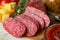 Ð¡oncept of tasty food with salami sausage, close up