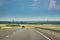 Oncoming Car On A Highway In Countryside. Cloudy, Stormy Sky.