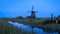 Ondermolen D windmill near Schermerhorn city in Netherlands during twilight