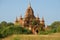 One of the ancient Buddhist temples of Bagan close-up sunny afternoon. Myanmar