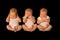 One baby three times in hear see speak no evil poses