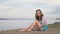 One beautiful teenage girl with brown hair outside on a beautiful summer day.