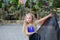 One beautiful young girl fits a modern dancer in a blue suit, a young dancer, dancing and jumping, Dance with a scarf. Young girl