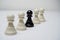 One Black Pawn Figure Among White Pawns Figure in a Line. Chess Concept