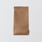 One Blank Painted Brown Paper Package Bulk Products Coffee Tea Isolated Empty Background.Clean Containers Mockup Ready