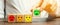 One block with a positive face stands out from the rest of the negative emotions. Concept of good rating, review and feedback.