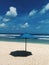 One blue beach sun umbrella make shade on the sand