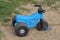 One blue black plastic childrens tricycle