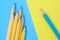 One blue pencil and group of yellow pencils. Difference concept.