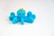 One blue plasticine octopus on white background, children`s games with modeling clay concept