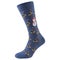 One blue sock with a pattern of many Christmas trees and snowmen, on a white background