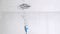 One blue toothbrush in a super slow motion vertically falling in water