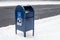 One blue United States Postal Service Mailbox