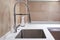 One bowl stainless steel kitchen sink and faucet in a modern style