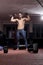 one boxer posing, indoors, fitness boxing equipment,