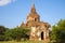 One of the Buddhist temples of ancient Bagan closeup on a Sunny day. Burma