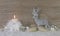 One burning advent candle with deer on wooden brown shabby backg