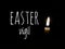 One candle burn brightly on dark background with text written Easter vigil.