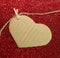 One carton heart attached to the rope on red shining background